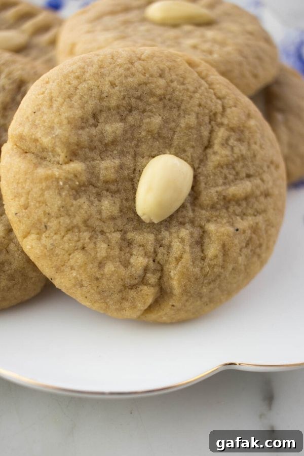 a close up of an almond cookie