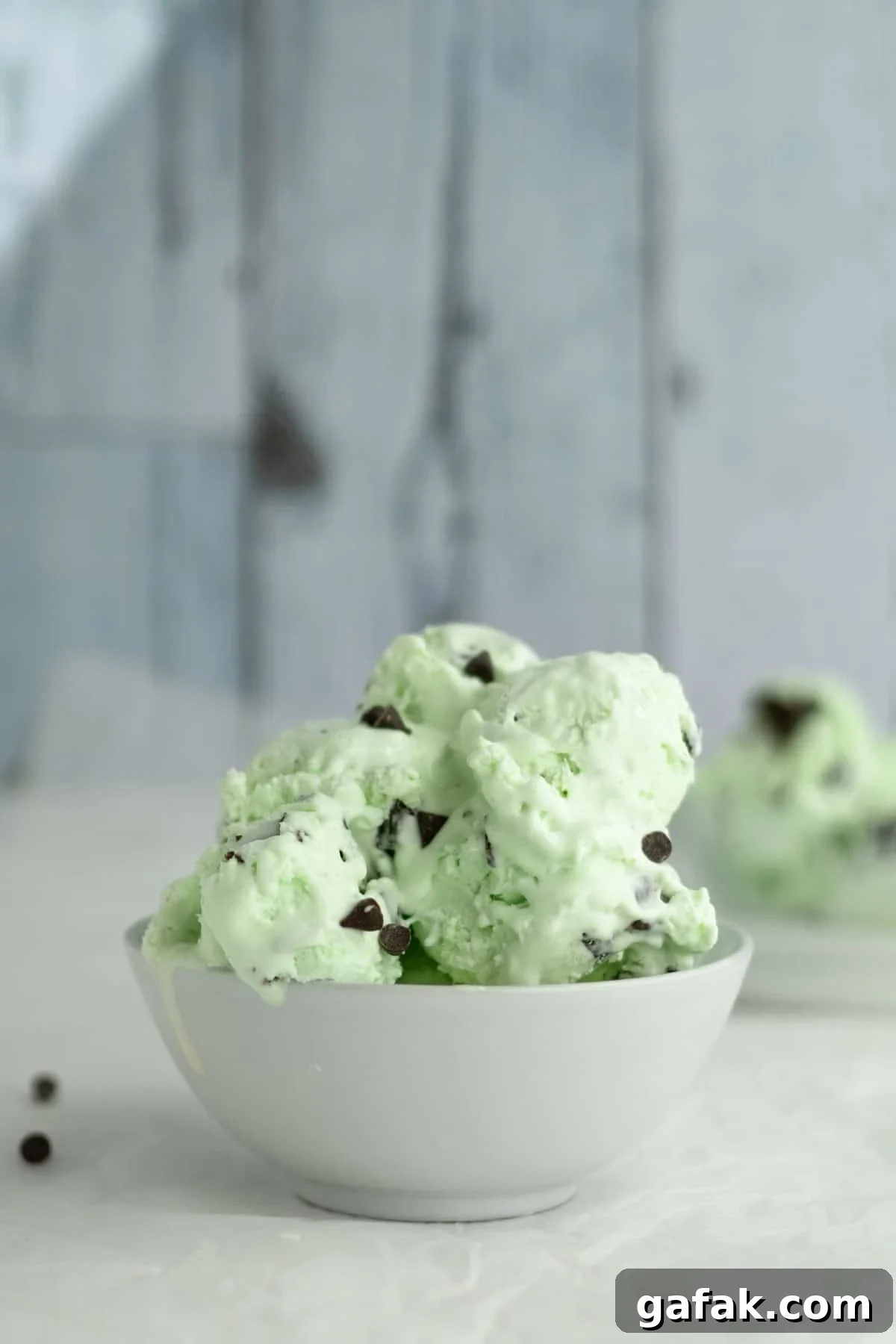 no churn mint chocolate chip ice cream in a white bowl