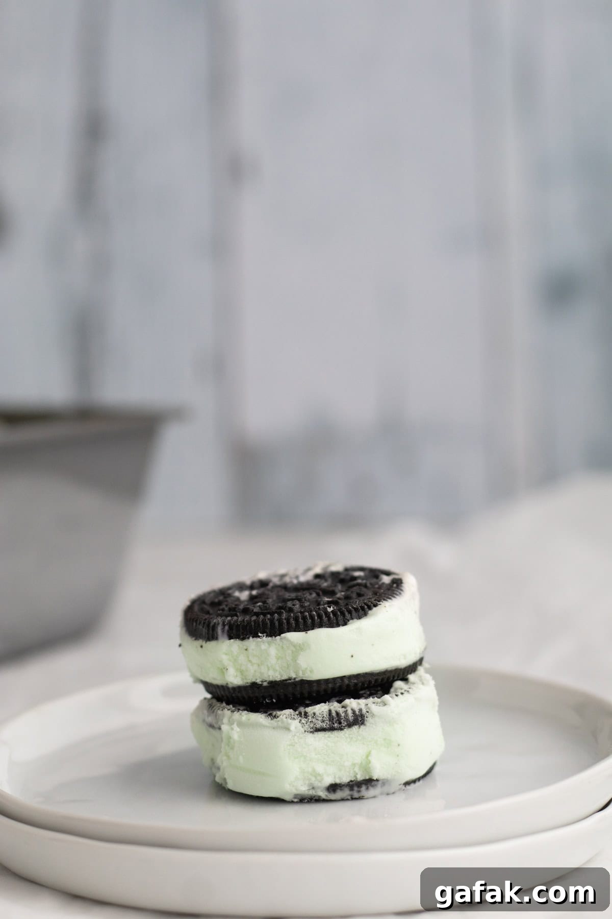 mint chip ice cream sandwiches stacked on a plate