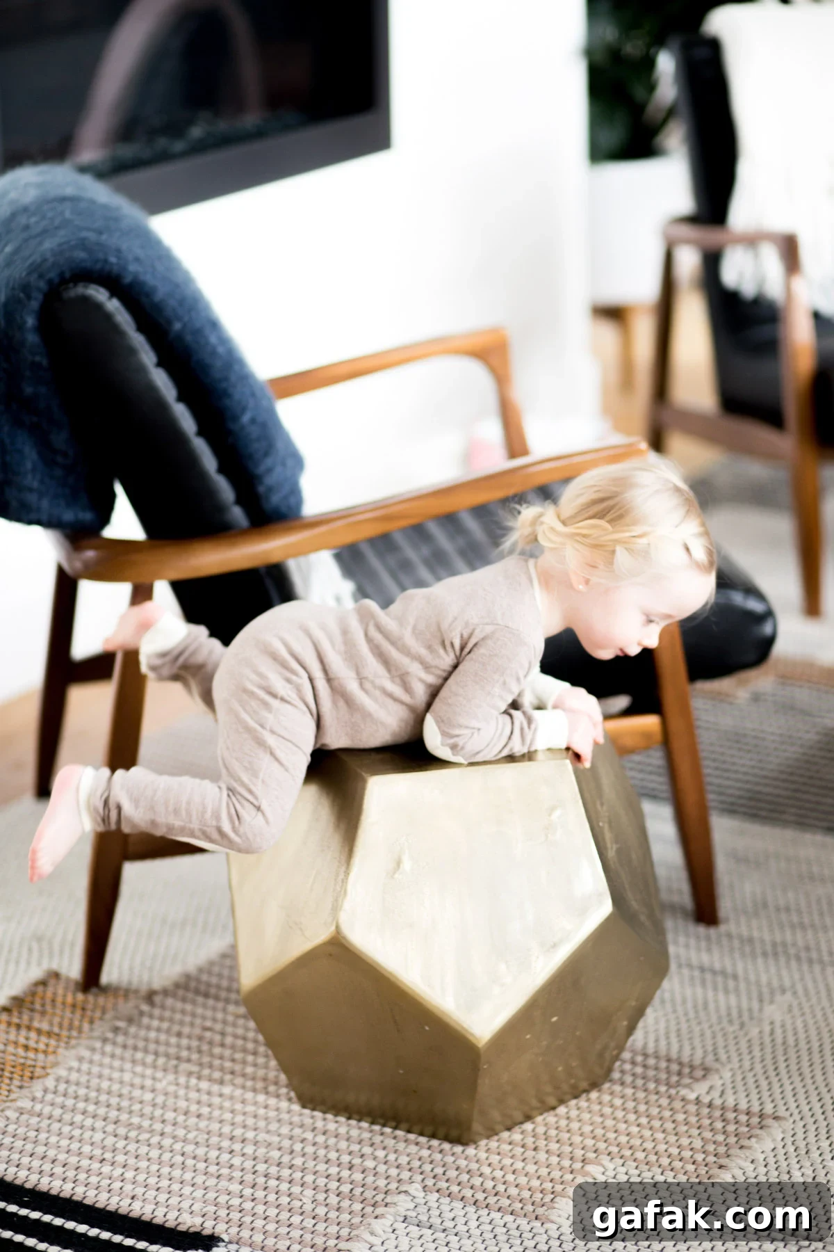 small girl climbing on a table modern furniture simple daily schedule for young kids printable