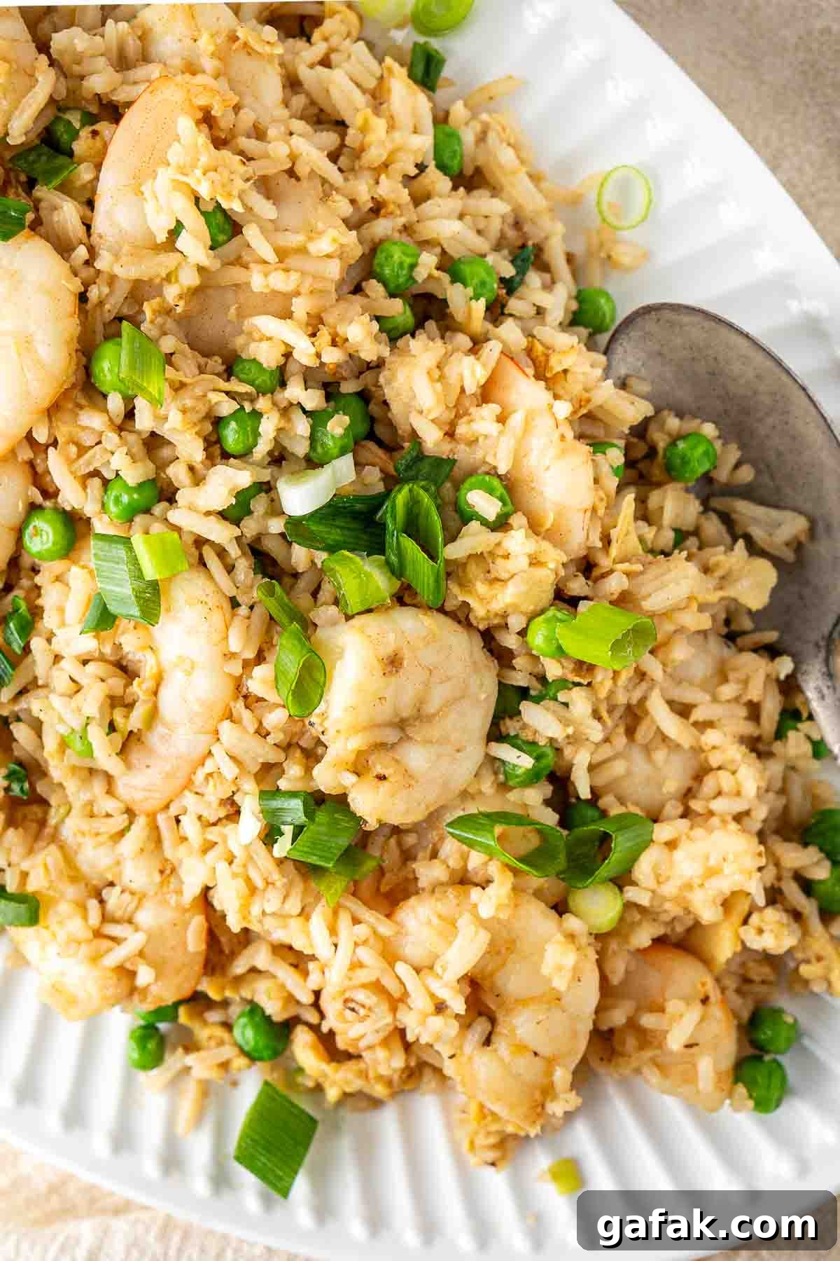 Garlic Prawn Egg Fried Rice Recipe for Quick Weeknight Meals 5 Close up of egg fried rice with prawns on a plate.