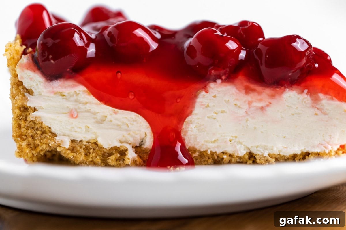 close up slice of no bake cherry cheesecake