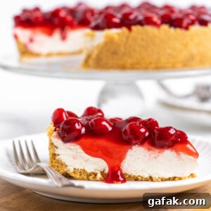 slice of no bake cherry cheesecake on plate with fork