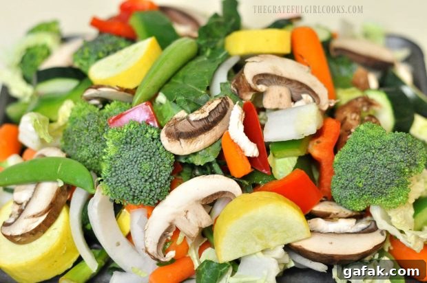 Fresh veggies are cut and prepped to add to chicken veggie stir fry.