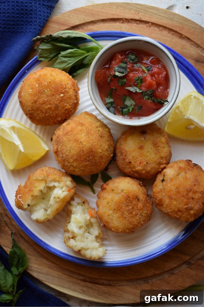 arancini on a plate with homemade marinara suace