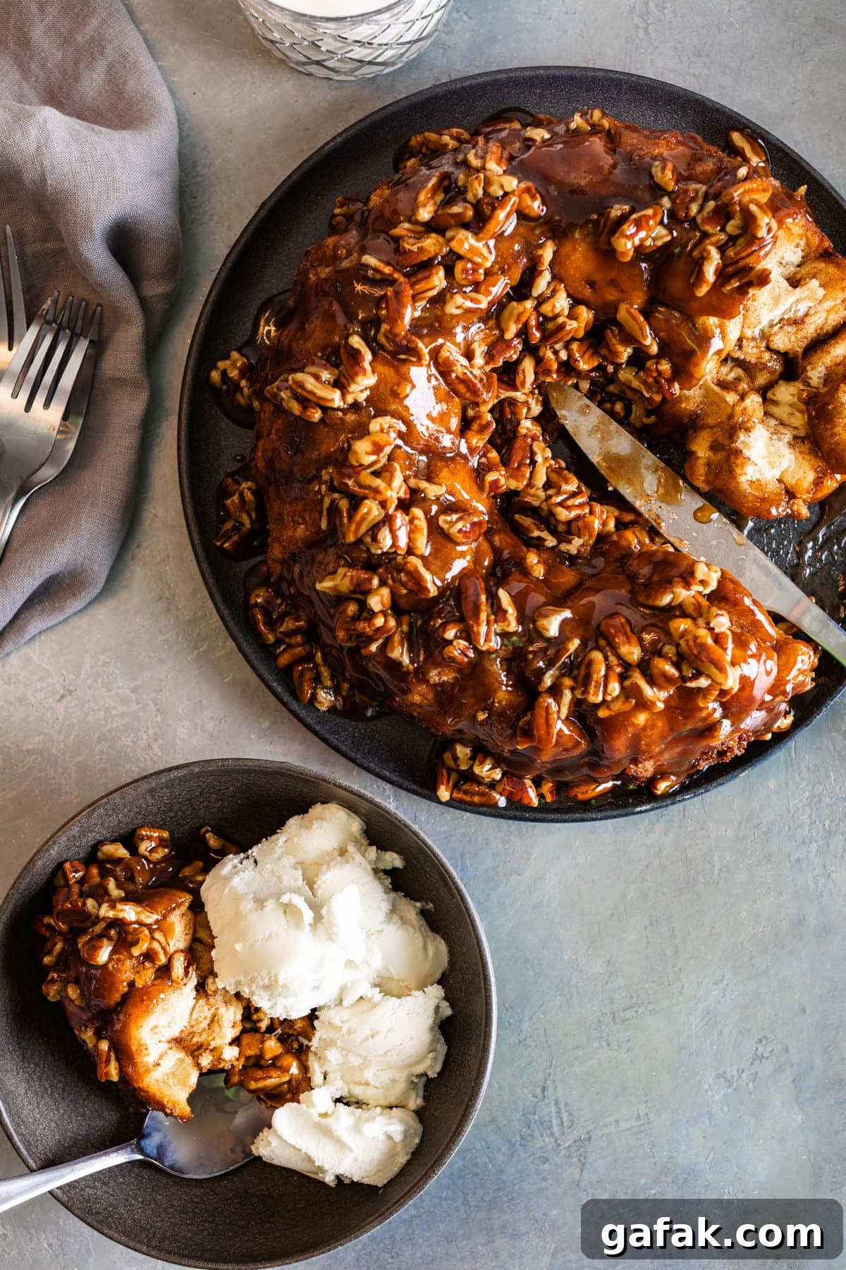 cinnamon roll monkey bread in a bowl with ice cream