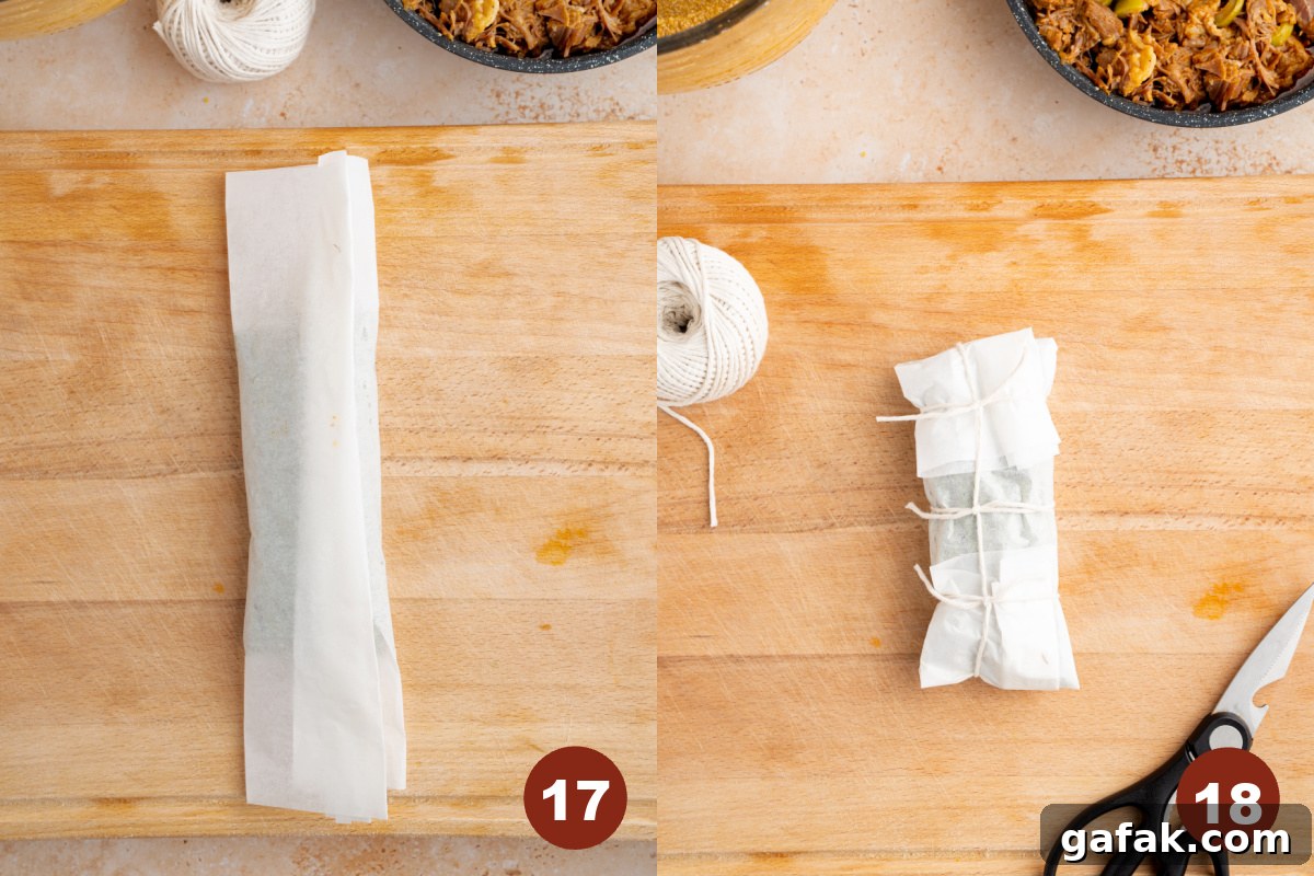 The banana leaf is completely wrapped and kitchen twine is wrapped 3 times around the parchment paper pocket to secure.