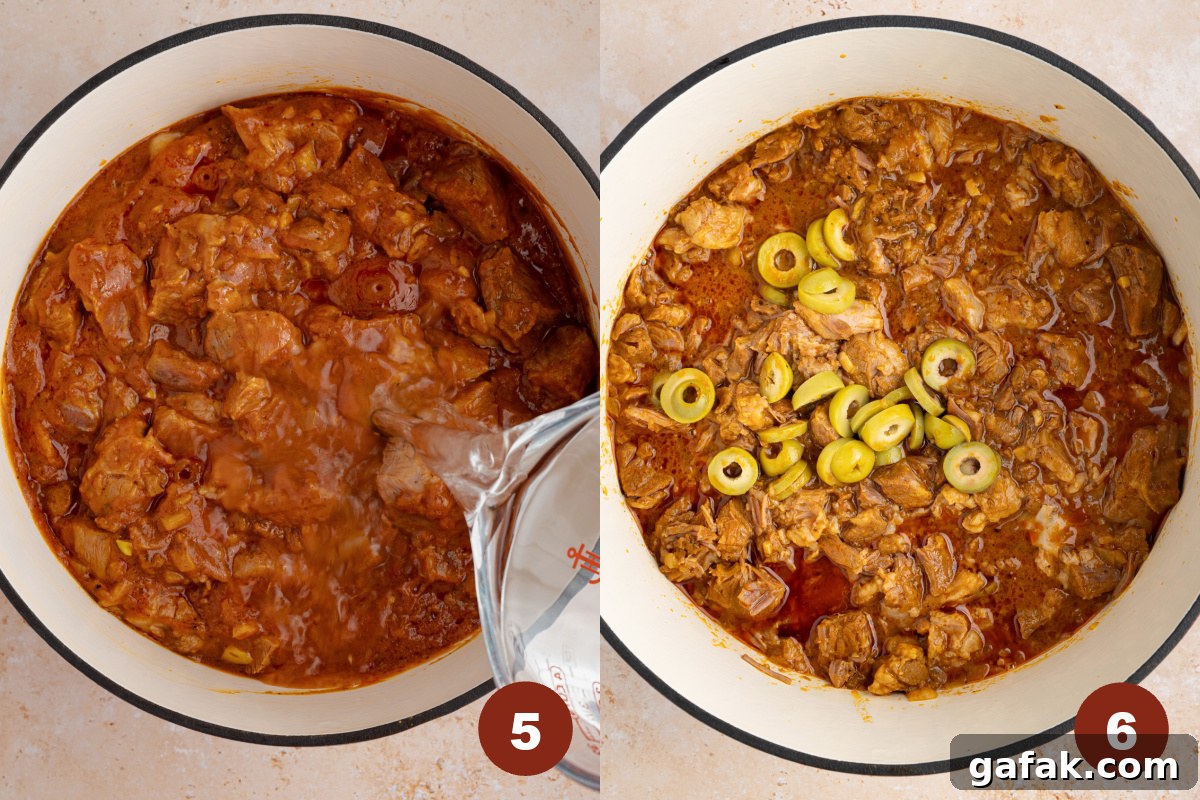 A measuring cup pours in water into a Dutch oven, then the sliced green olives are on top. 