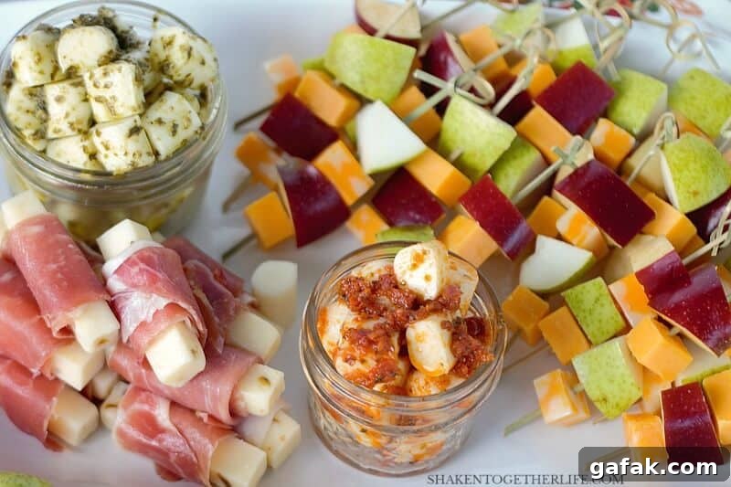 3 EASY Cheesy Appetizers - these simple cheese appetizers start with cheese sticks! Pesto mozzarella bites, prosciutto wrapped pepper jack and fruit & cheese skewers are simple, delicious and perfect for entertaining!