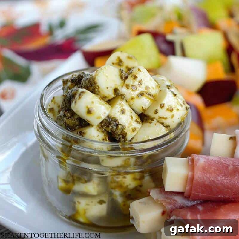 3 Easy Cheesy Appetizers made with cheese sticks - Pesto Mozzarella Bites