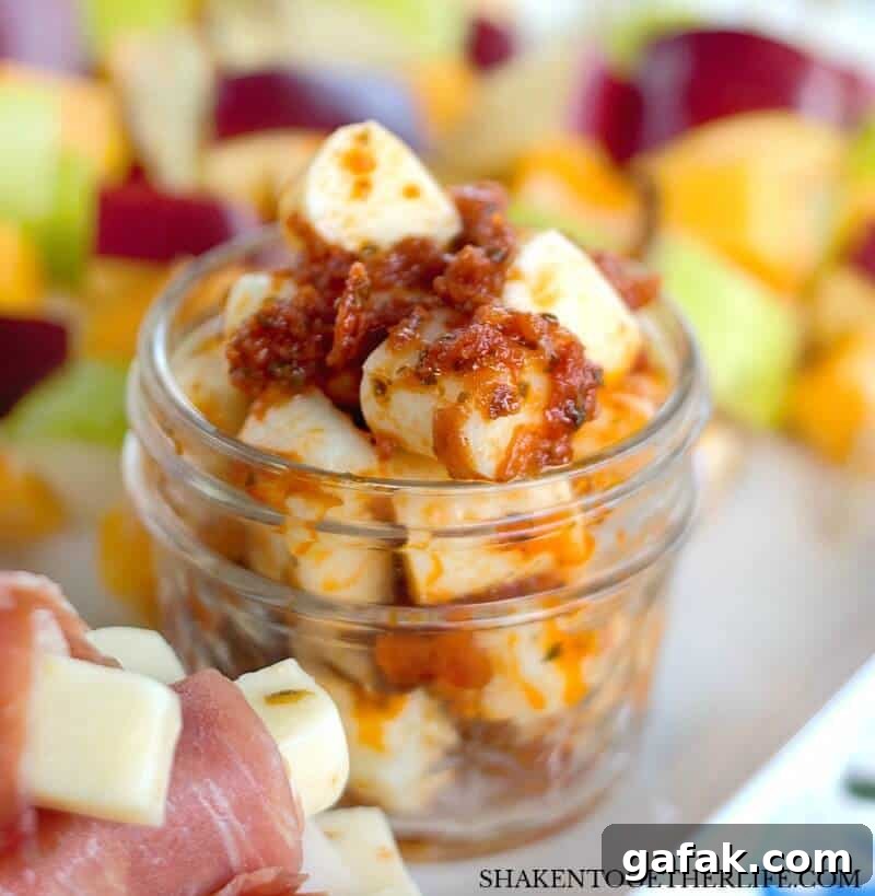 3 Easy Cheesy Appetizers made with cheese sticks - Pesto Mozzarella Bites