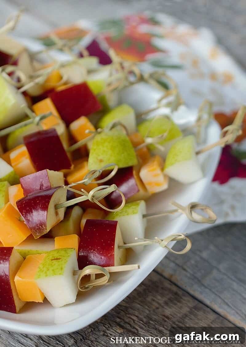 Sharp Cheddar & Colby-Jack cheese paired with apples and pears make up these Fruit & Cheese Skewers - just 1 of 3 Easy Cheesy Appetizers using cheese sticks!