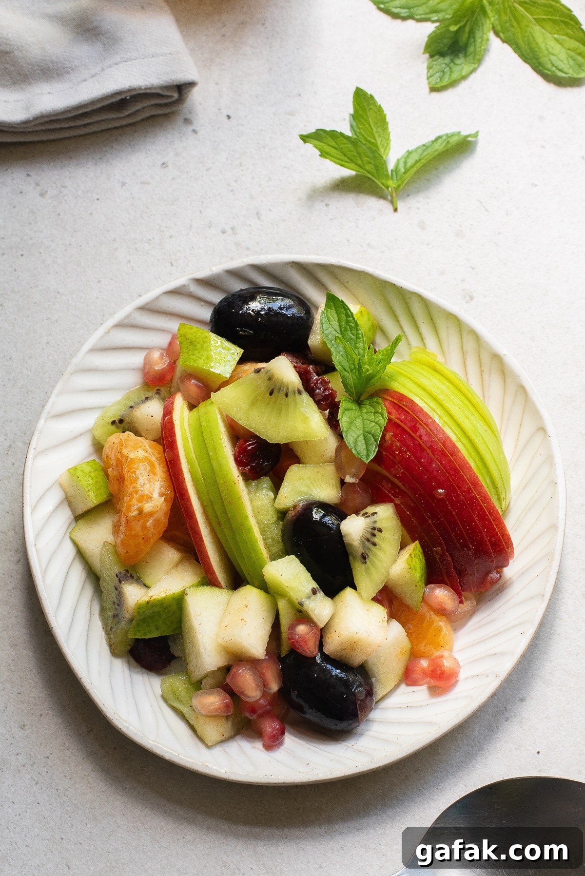 Thanksgiving fruit salad on a white plate.