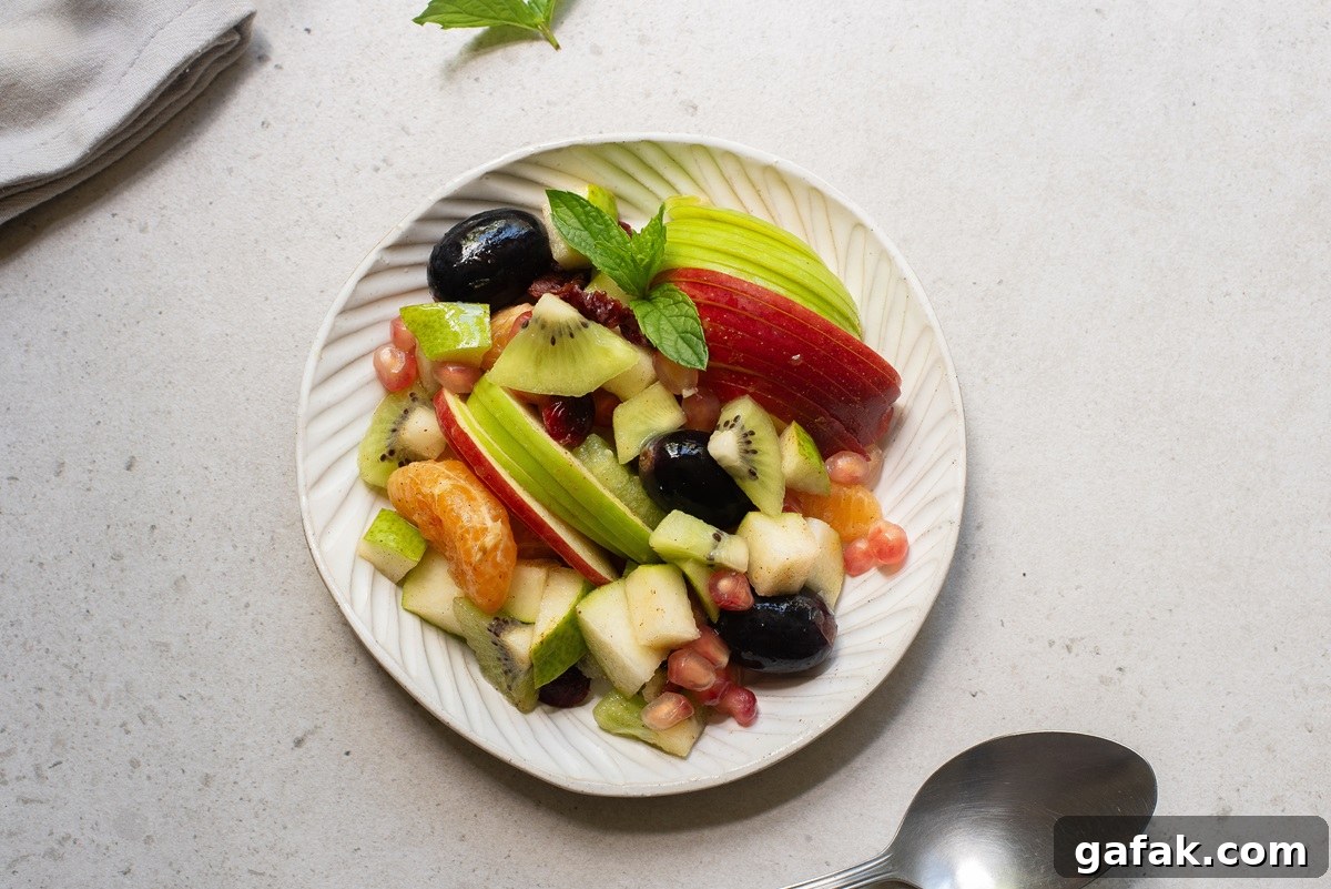 Fruit salad in a white plate.