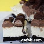 Kinder Bueno topped cheesecake on a plate.