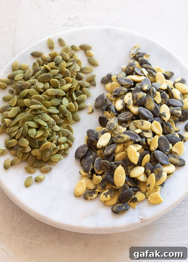 Two different kinds of pumpkin seeds, green pepitas on the left and an heirloom variety on the right.