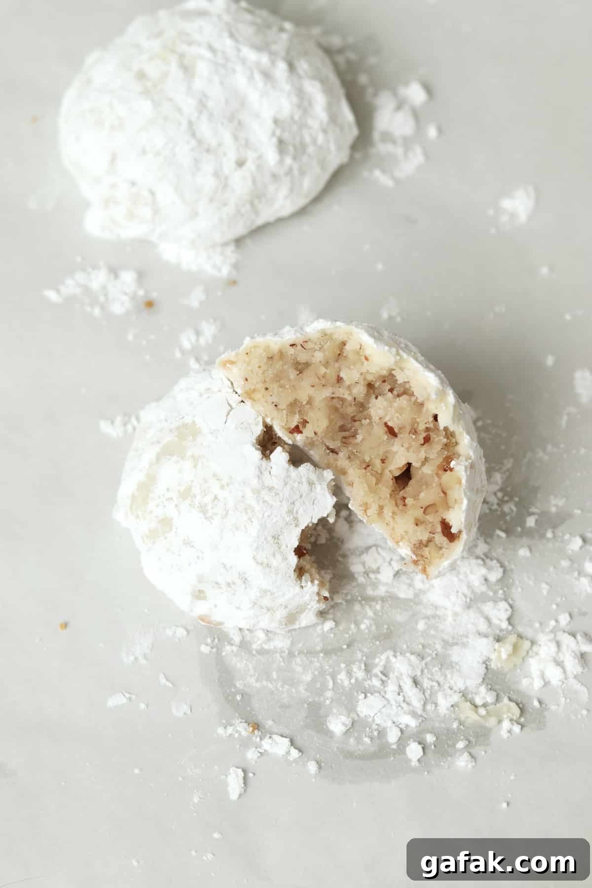 Single serve snowball cookie made with chopped pecans and rolled in powdered sugar.