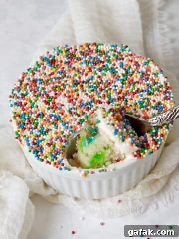Single serve dot cake with nonpareils in a ramekin.