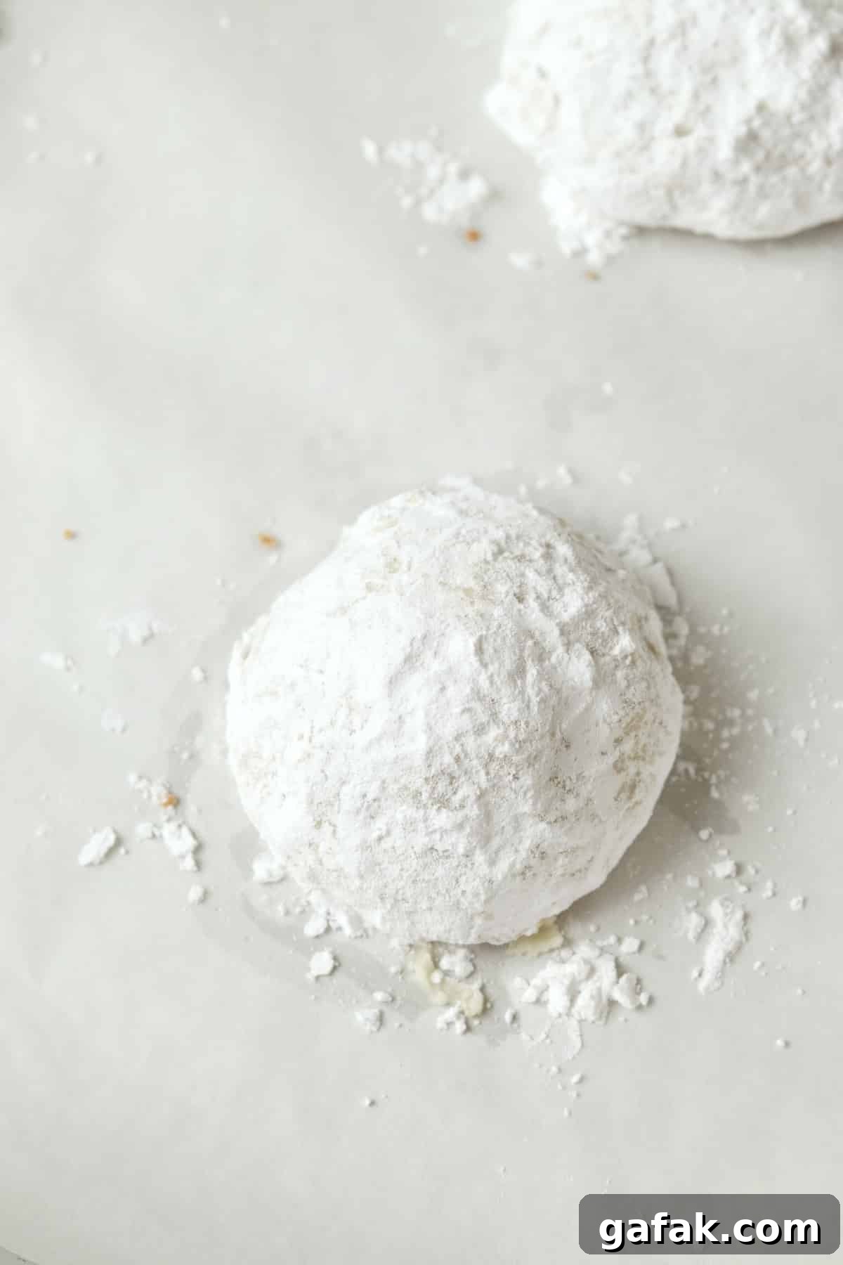 Small batch Russian tea cakes on a baking sheet.