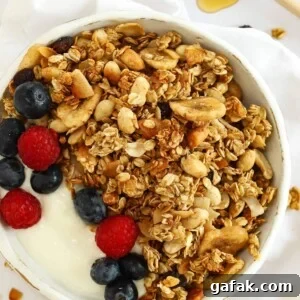 Make delicious granola with oats, nuts and fruit in the slow cooker easily.