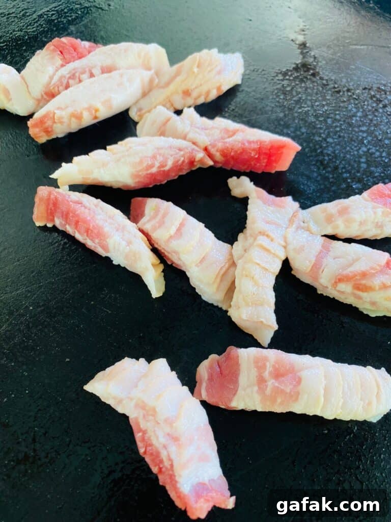 bacon on the griddle before cooking