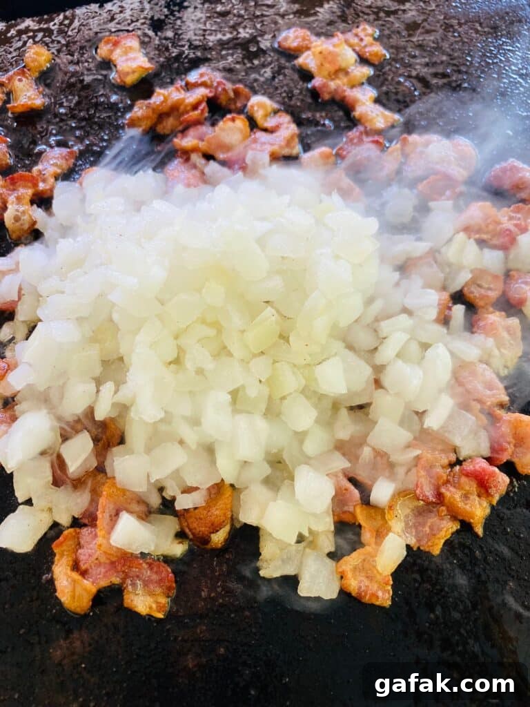 adding onion to the bacon