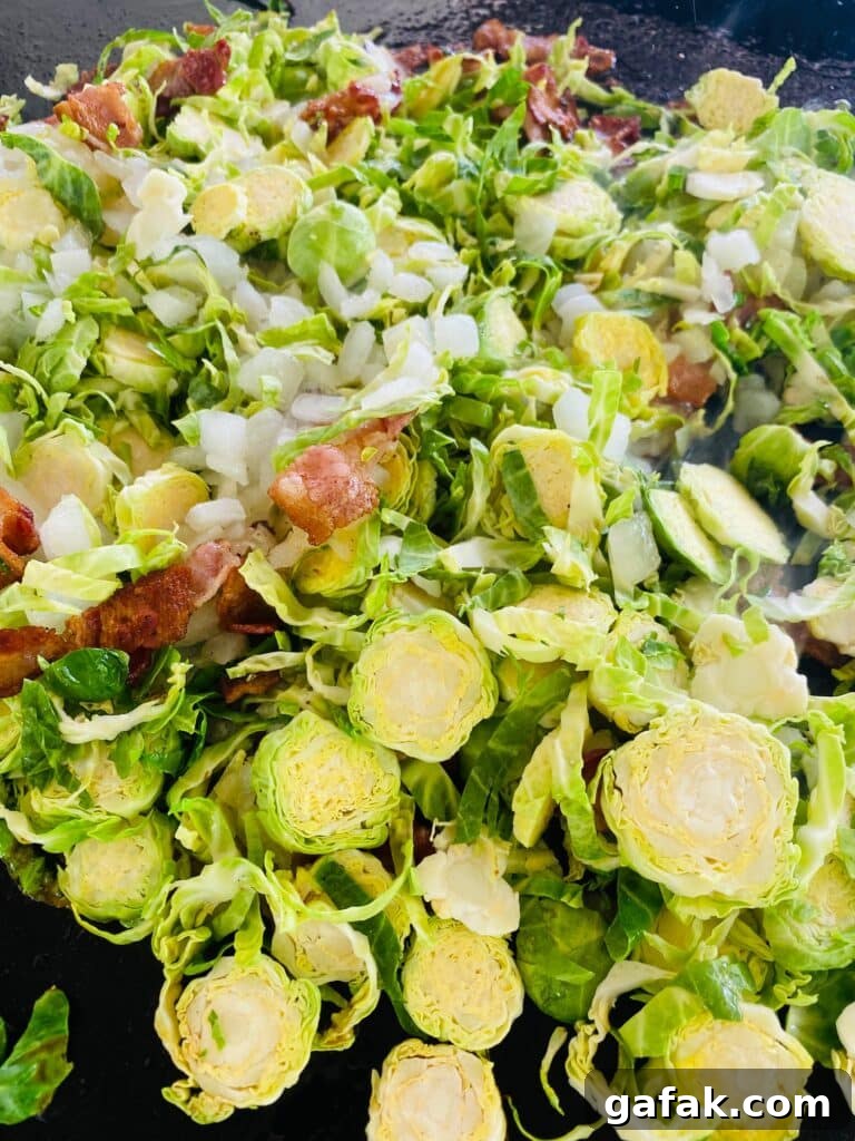 adding the brussel sprouts to the griddle