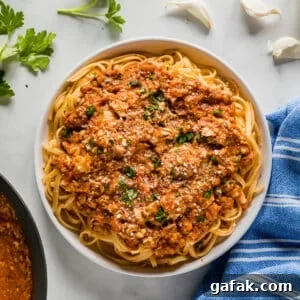 An overhead image of a bowl of linguine with clam sauce.