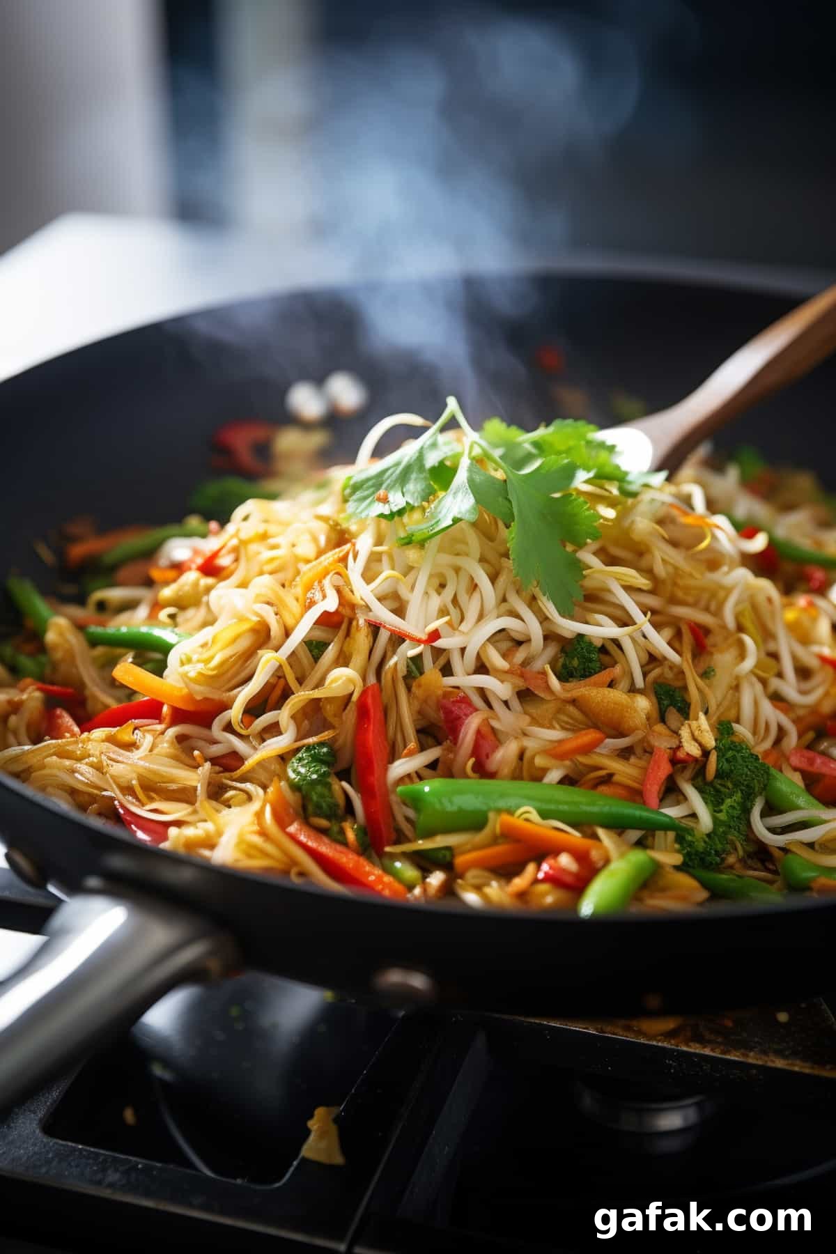Vegetable pad thai in a frying pan.