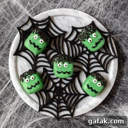 chocolate cookie truffles decorated in green chocolate and candy eyes