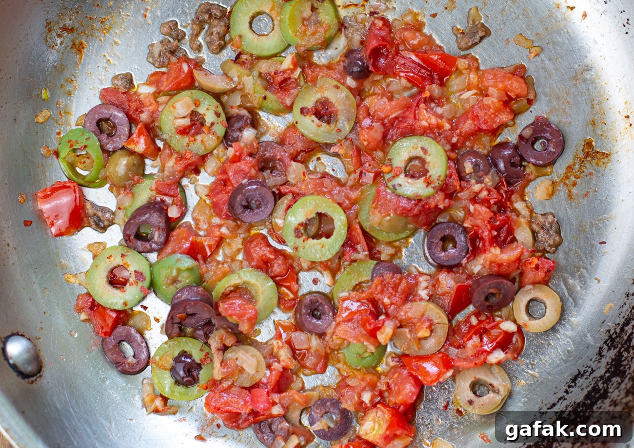 Puttanesca Rice-Stuffed Tomatoes (Karen’s Savory Recipe) 5 Sauté onions, garlic, chopped tomatoes, and olives then fold in the cooked rice