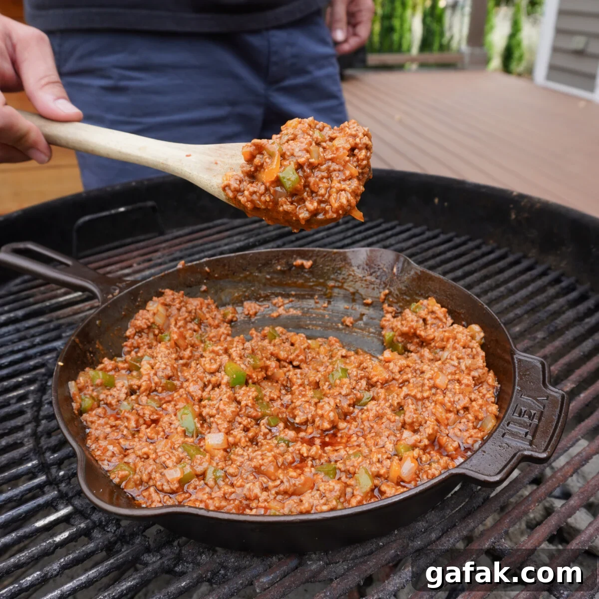 Sloppy joe mixture cooked in a cast iron skillet.