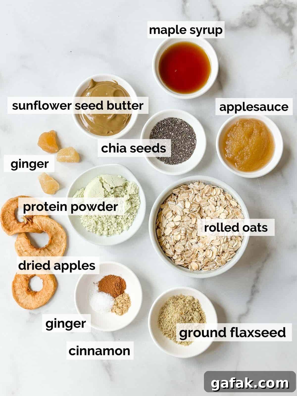 Ingredients for oatmeal protein balls with apples and ginger on a white background.