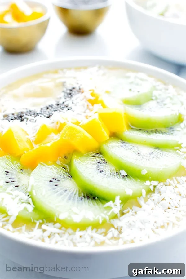 Mango Kiwi Chia Seed Smoothie Bowl (V+GF): a super easy recipe for a light, refreshing and filling smoothie bowl full of mangoes and topped with kiwis. #Vegan #GlutenFree | BeamingBaker.com