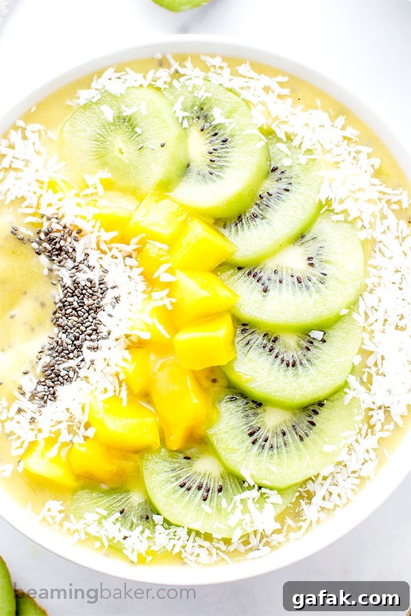 Mango Kiwi Chia Seed Smoothie Bowl (V+GF): a super easy recipe for a light, refreshing and filling smoothie bowl full of mangoes and topped with kiwis. #Vegan #GlutenFree | BeamingBaker.com
