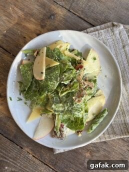 a photo of the apple salad plated on a white plate