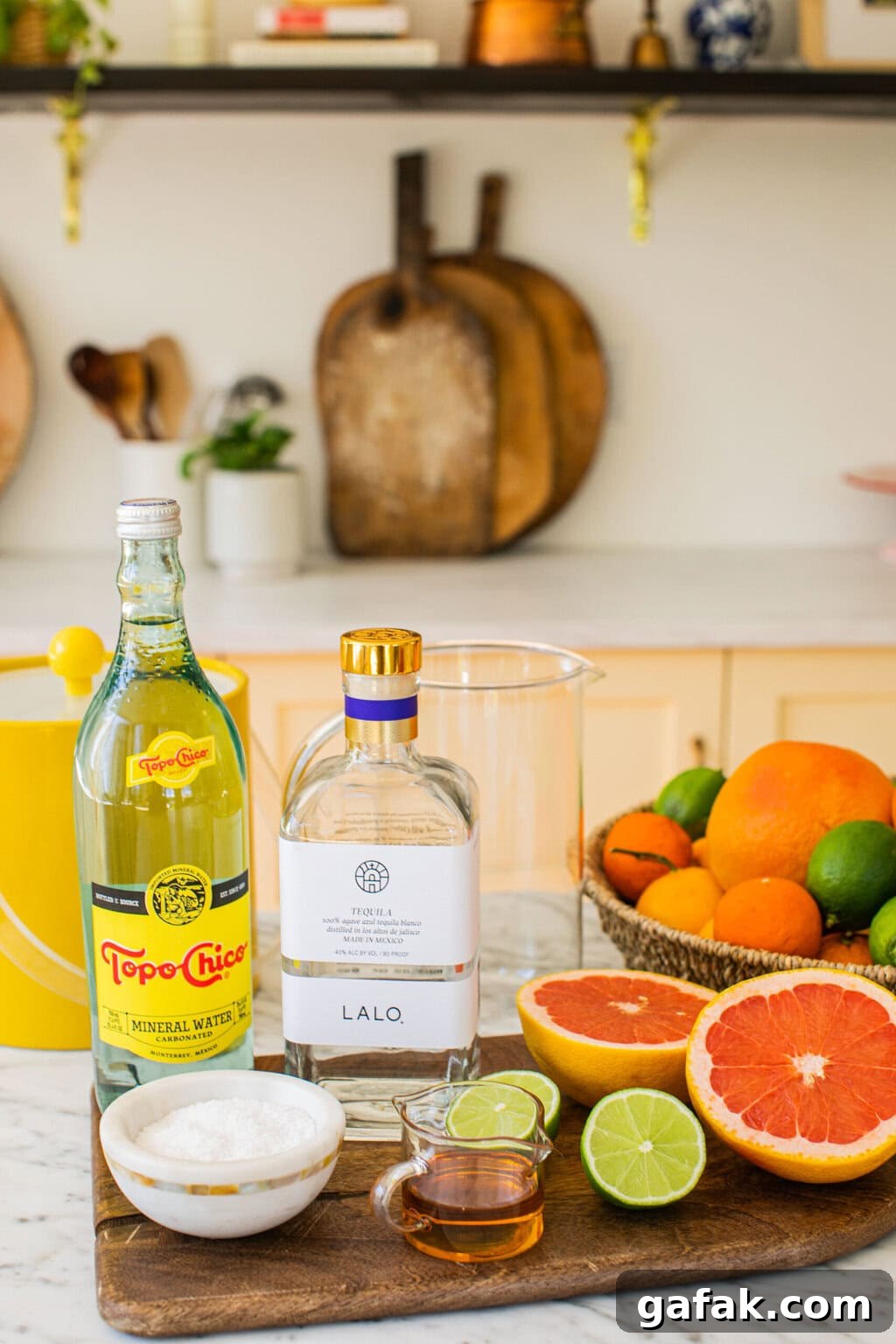 Make-Ahead Paloma Pitcher Cocktail Recipe 4 tequila, grapefruit juice, lime juice, topo chico, and salt