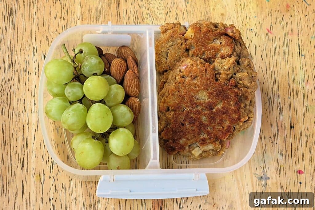 apple and weetbix pikelets in lunch box with grapes and almonds