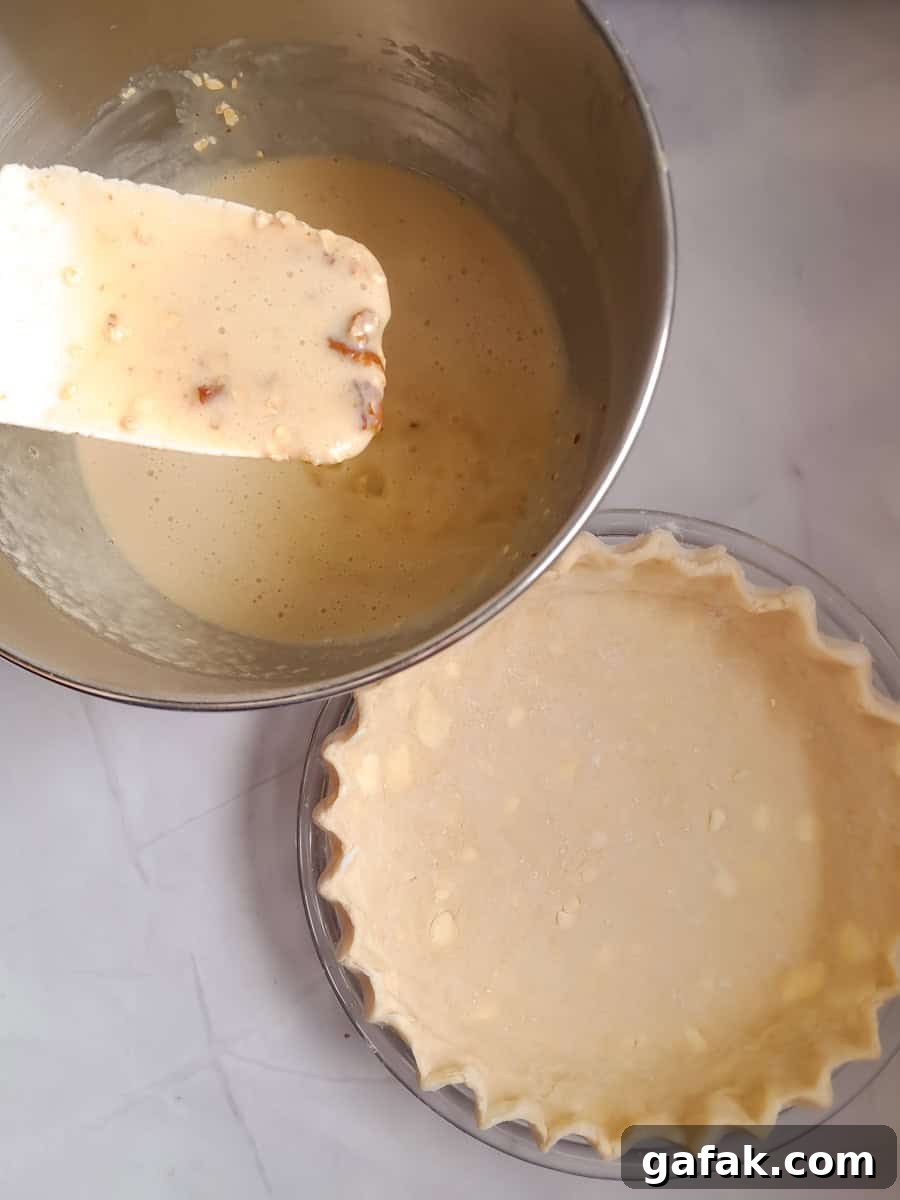 Amish Oatmeal Pie Recipe (Pecan-Style Mock Pie) 4 Empty pie crust and liquid mixture in a bowl, ready to assemble our pie.