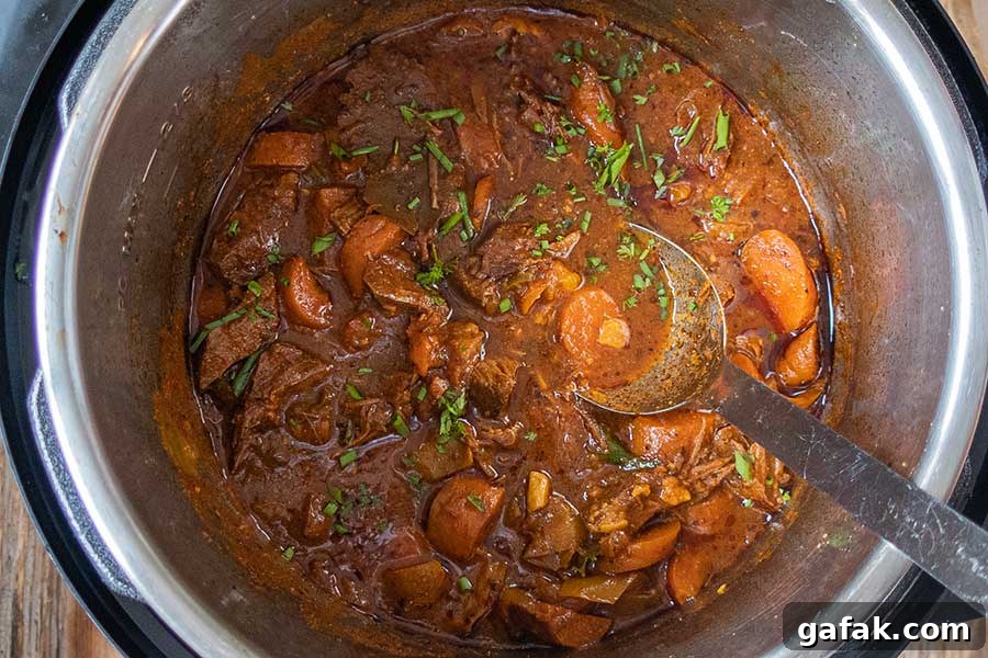 Dominican beef stew simmering in a pot