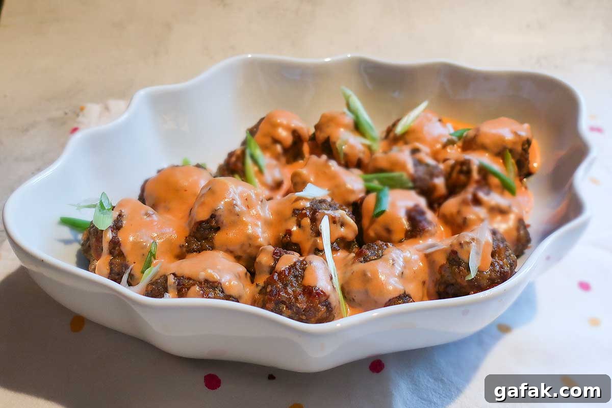 beef and pork meatballs with sauce in a bowl