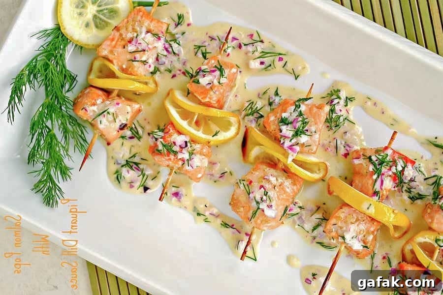 salmon skewers with sauce on a platter