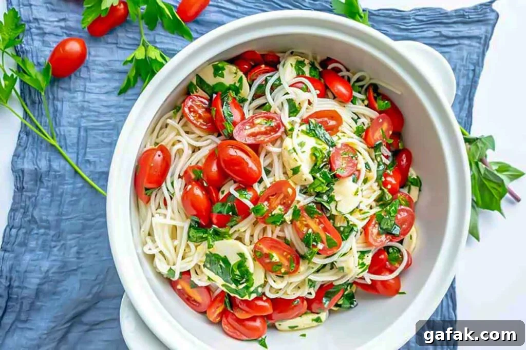 gluten free vegetarian Italian pasta salad with fresh tomatoes in a bowl