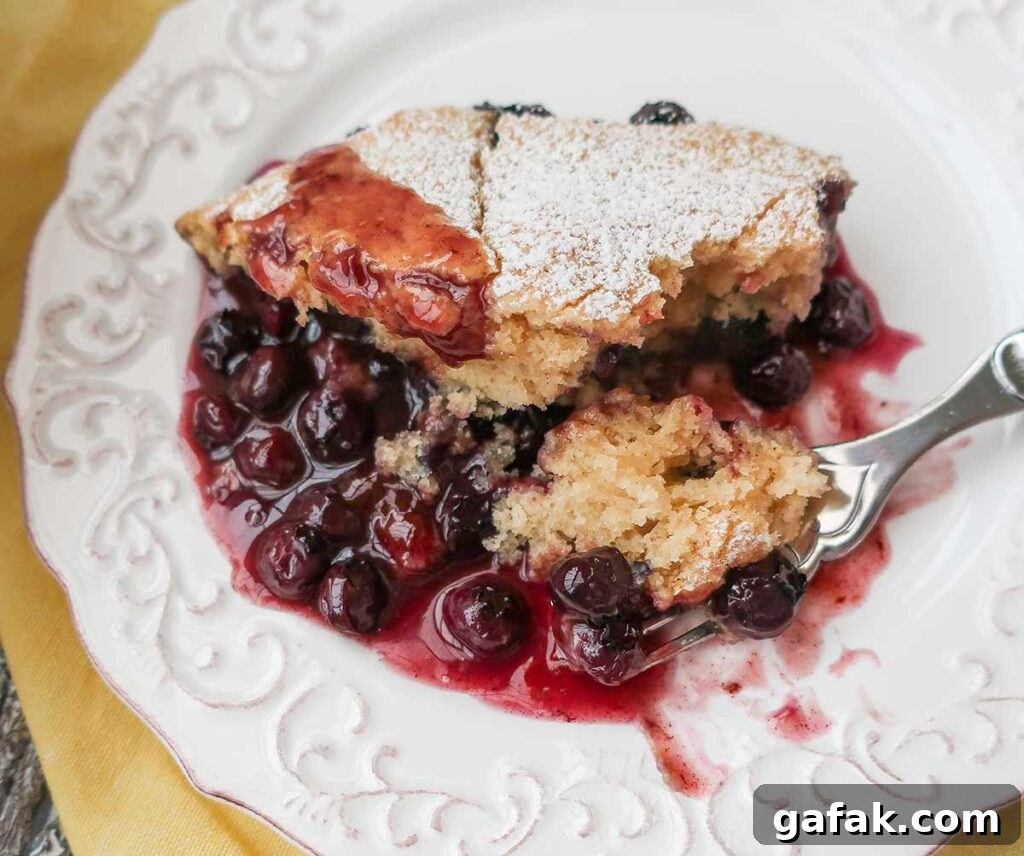 a slice of pudding cake with blueberries on a plate