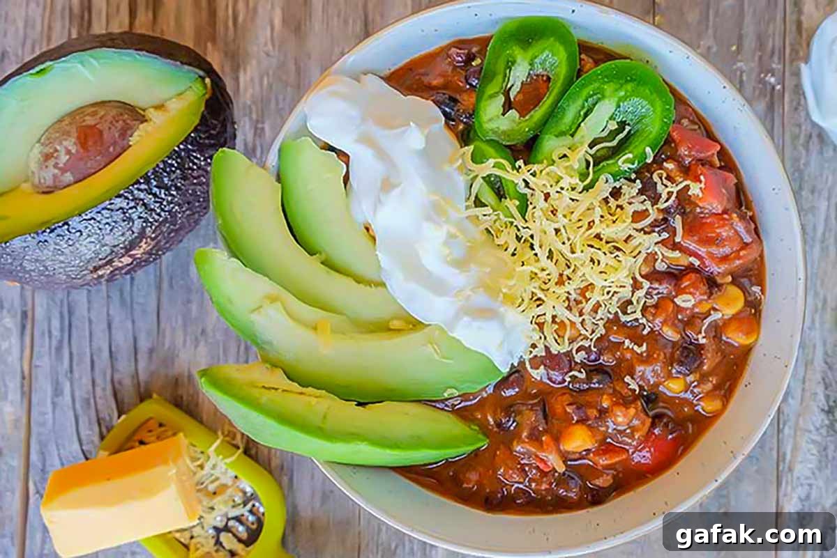 Cincinnati black bean chili in a bowl with toppings, gluten free