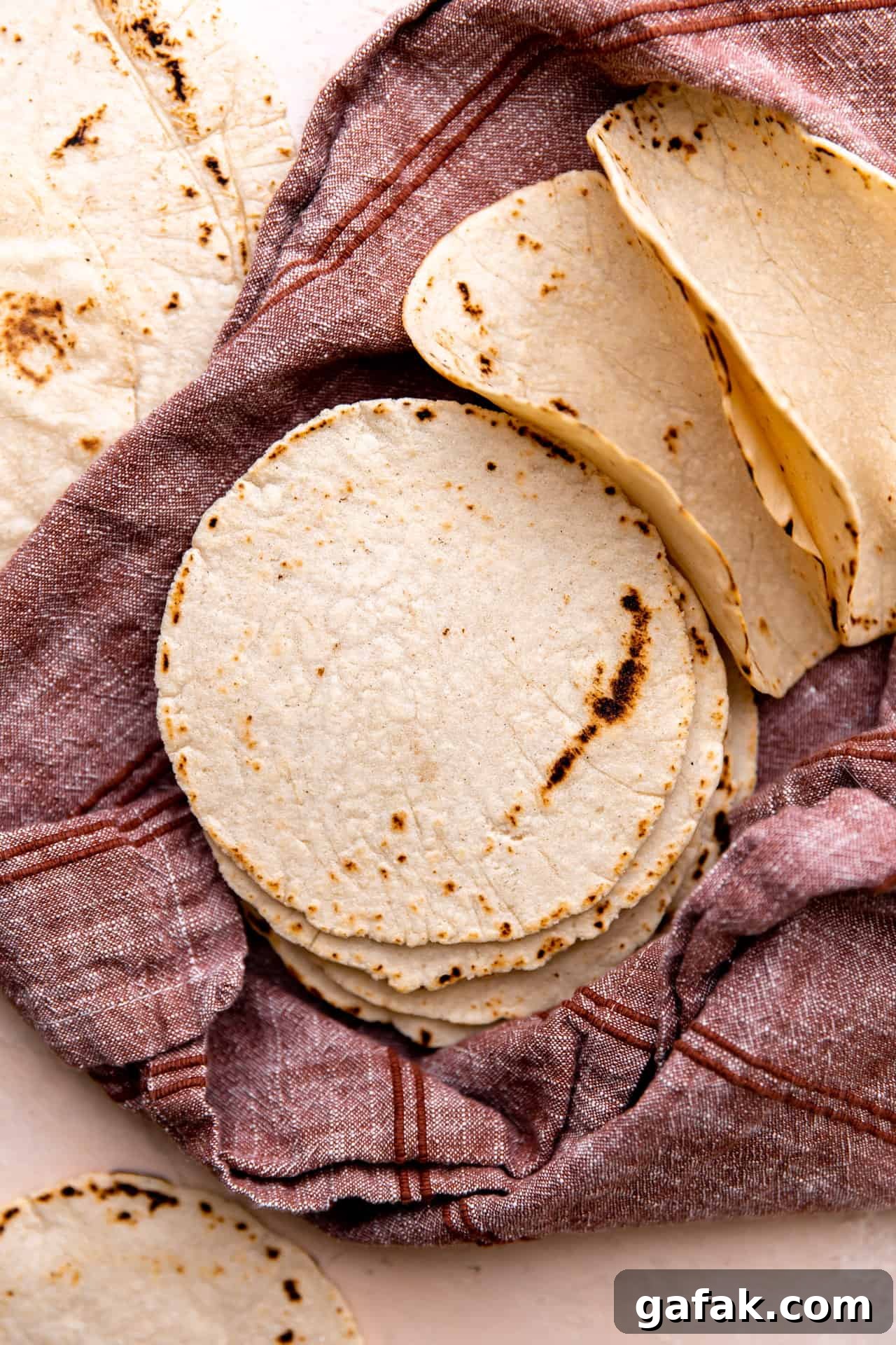 Stack of fresh homemade corn tortillas. 