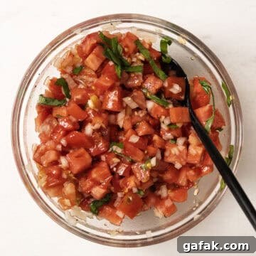 Bruschetta combined in a bowl.