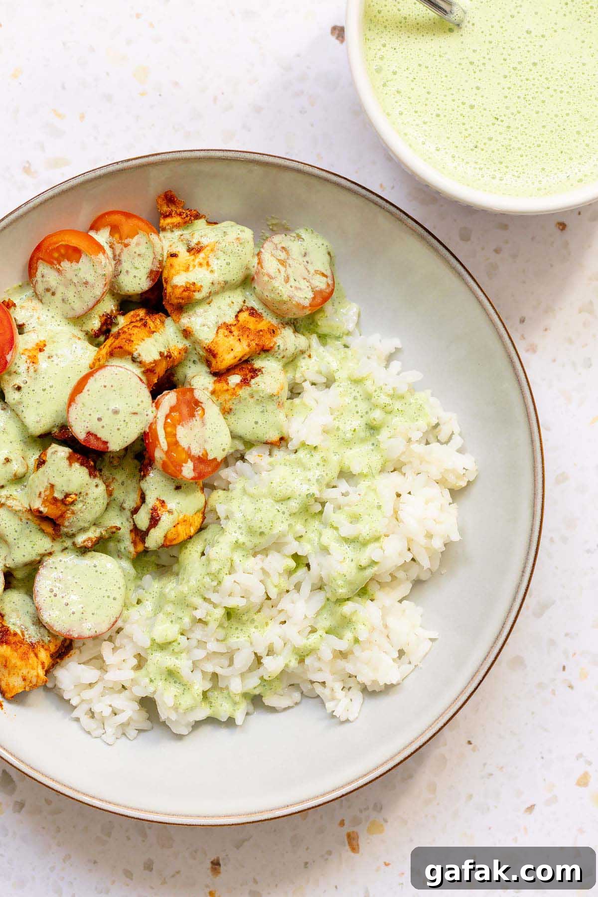 Yogurt mint sauce topping chicken and rice