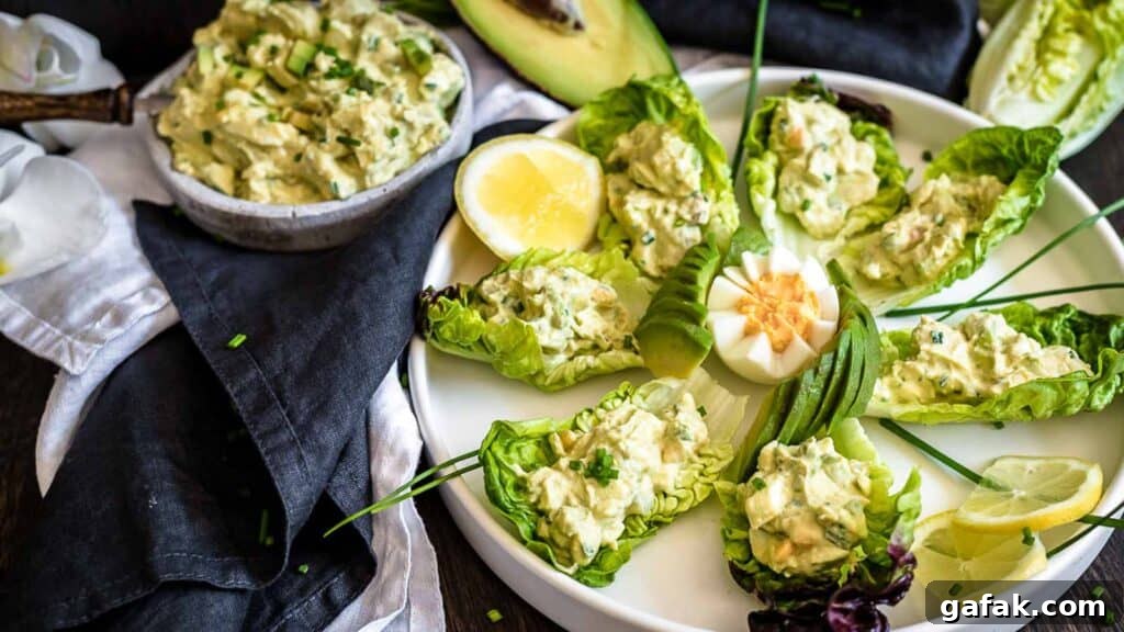 21 Packed Lunch Ideas to Make Midday Meals Exciting Again 2 Avocado Egg Salad on a salad leaves.