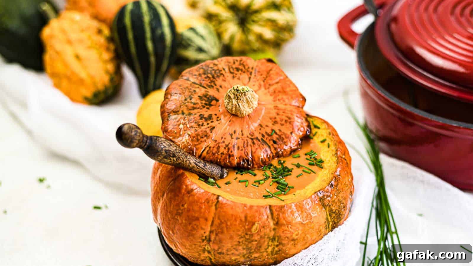21 Packed Lunch Ideas to Make Midday Meals Exciting Again 8 Creamy Roasted Pumpkin Soup inside baked pumpkin bowl.